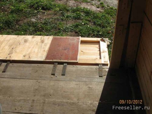 Конструкция деревянного гаража с подъемными воротами.