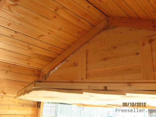 Конструкция деревянного гаража с подъемными воротами.