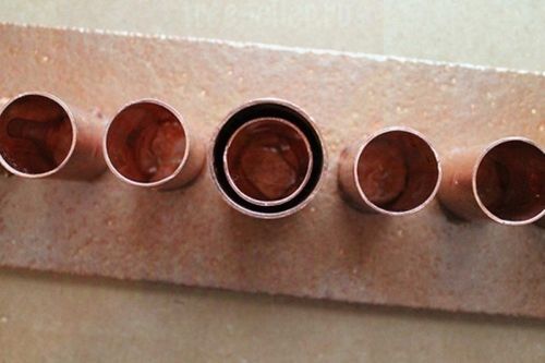 Подсвечник из медных труб